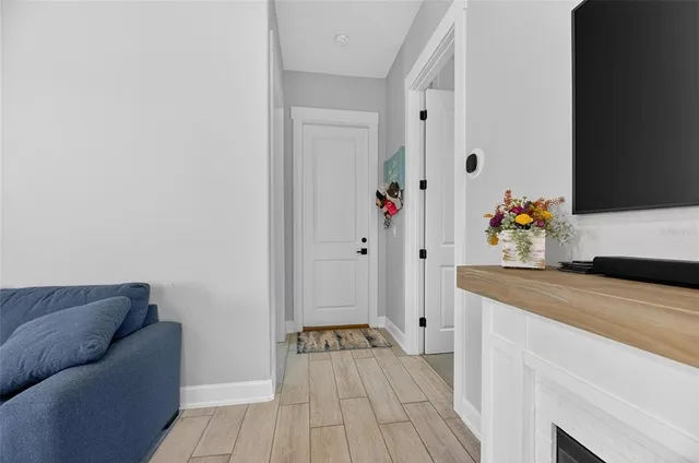 a bedroom with a bed and a table chair