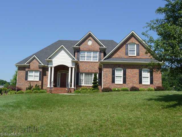 4460 Cotswold Road Pfafftown, NC 27040 - Photo 1 of 9 Exterior Front. All brick custom built by Alan Fletcher in Reagan school district with room to expand on 2nd floor and basement.