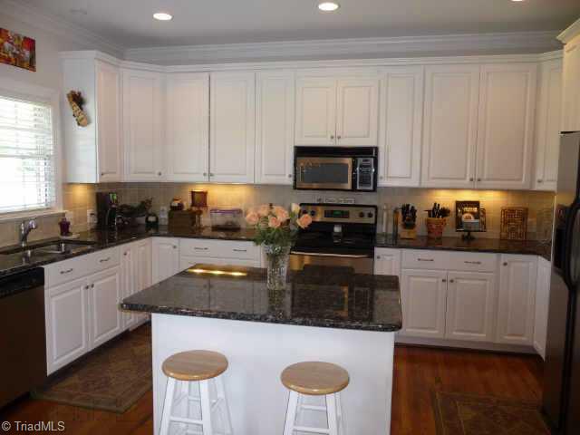 4460 Cotswold Road Pfafftown, NC 27040 - Photo 4 of 9 Other. Beautiful kitchen with granite counters, tile backsplash, island, recessed lights and under counter lights. Stainless steel appliances include, stove, microwave & DW. Pantry with pull out shelves.