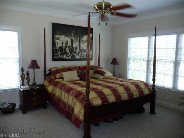 4460 Cotswold Road Pfafftown, NC 27040 - Photo 6 of 9 Other. Main level master bedroom with crown molding, 9 ceilings, ceiling fan, recessed lights and walk in closet. Crown molding and ceiling fans in 2nd and 3rd bedrooms.