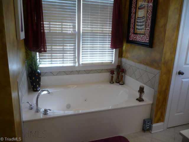 4460 Cotswold Road Pfafftown, NC 27040 - Photo 7 of 9 Other. Master bath has double sinks, jetted tub, separate shower, tile floors and separate toilet area.