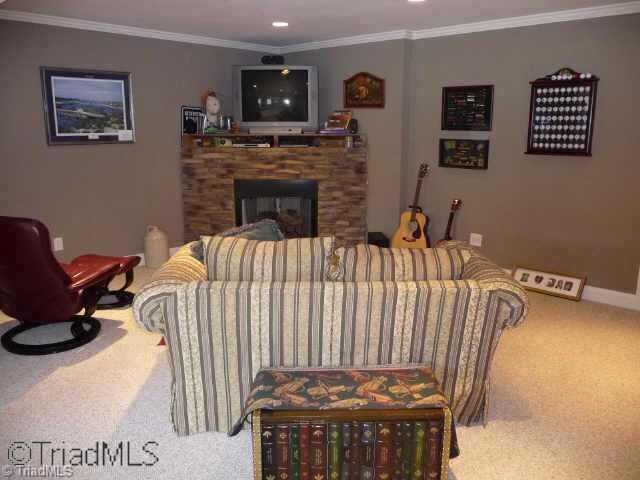 4460 Cotswold Road Pfafftown, NC 27040 - Photo 8 of 9 Other. Lower level Den has crown molding, stacked stone fireplace with gas logs and recessed lighting. Extra room on LL would be great for home office with outside entrance.