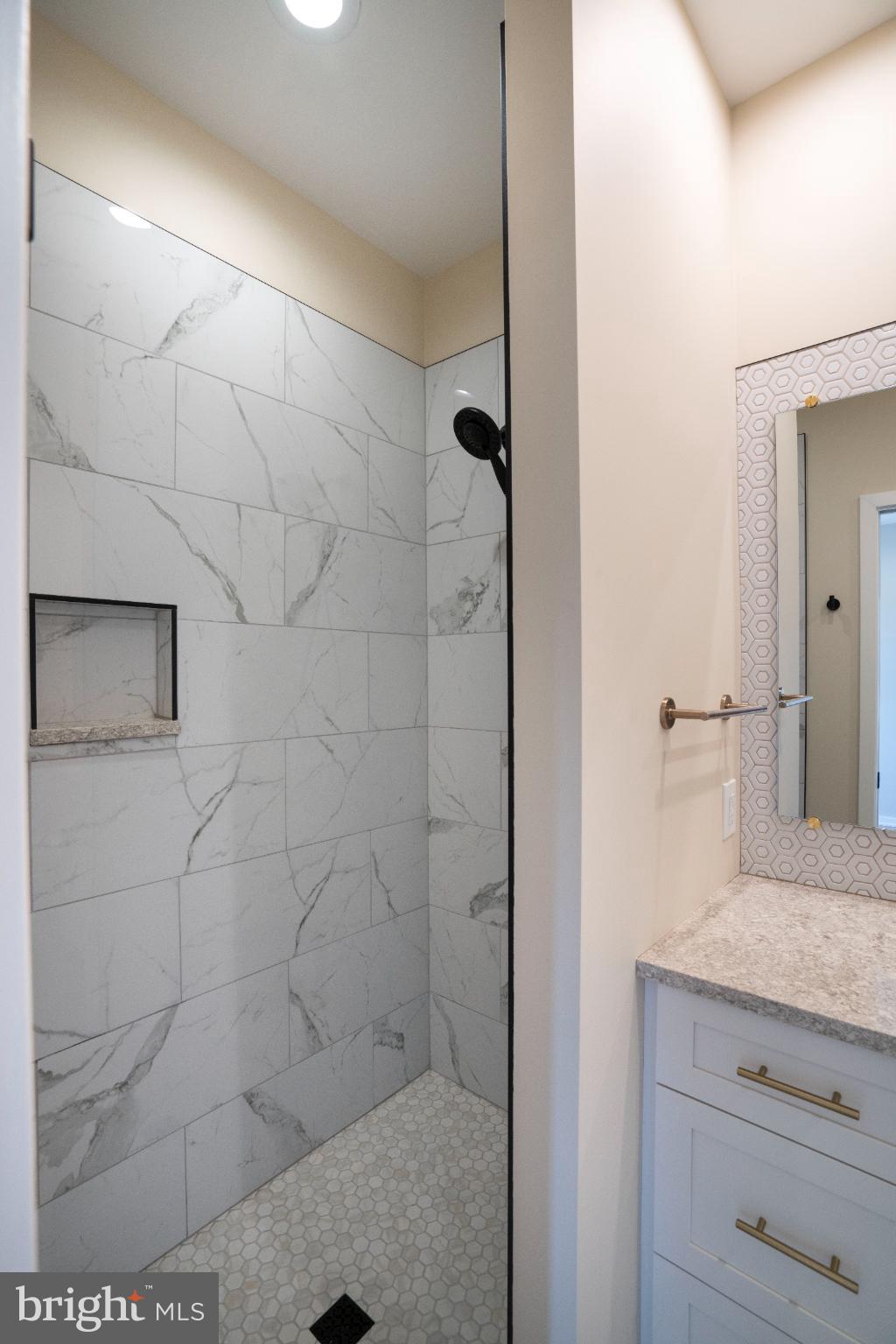 390 Trout Road State College, PA 16801 - Photo 40 of 78 Sleek modern shower with elegant tiles.