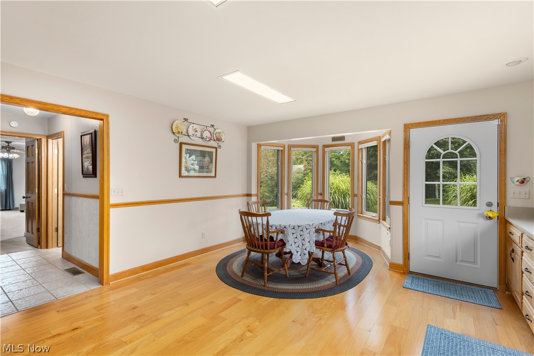10909 Ruby Road Cambridge, OH 43725 - Photo 18 of 34 Dining area featuring light wood-type flooring and ceiling fan