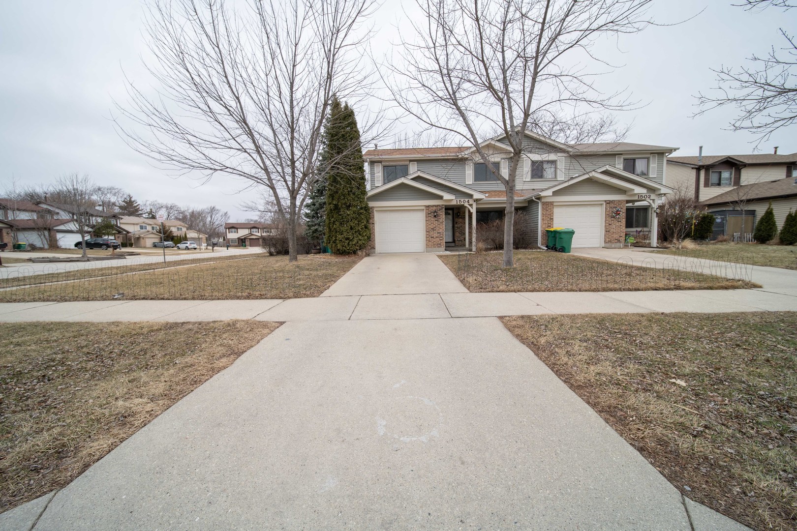 1504 Chippewa Trail Wheeling, IL 60090 - Photo 1 of 28 front view of a house with a yard