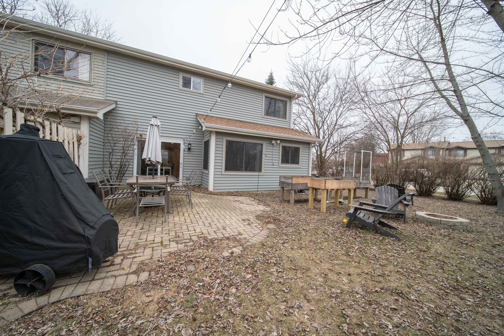 1504 Chippewa Trail Wheeling, IL 60090 - Photo 26 of 28 a backyard of a house with table and chairs