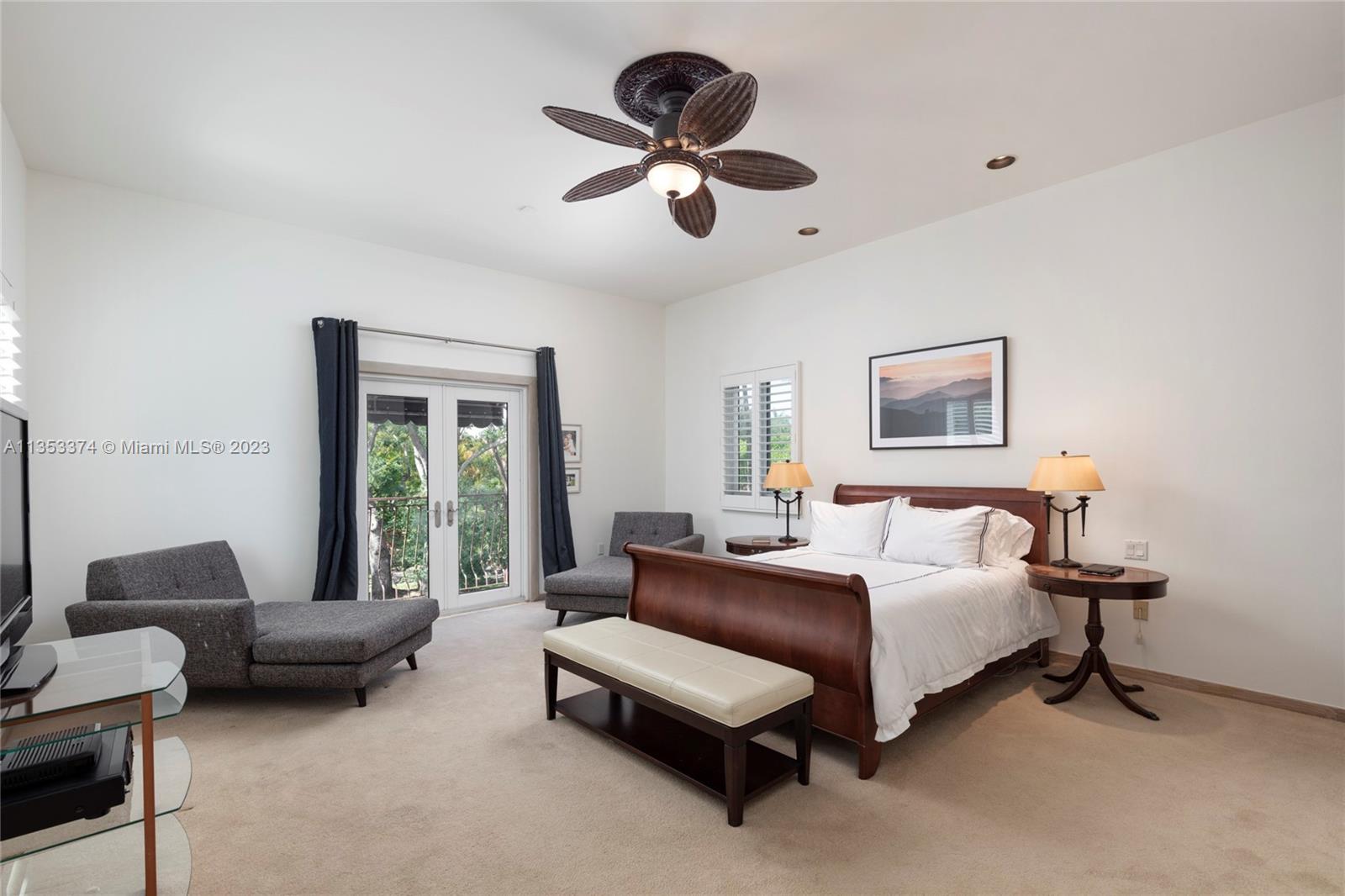 6745 Southwest 94th Street Pinecrest, FL 33156 - Photo 10 of 24 a living room with furniture ceiling fan and a window