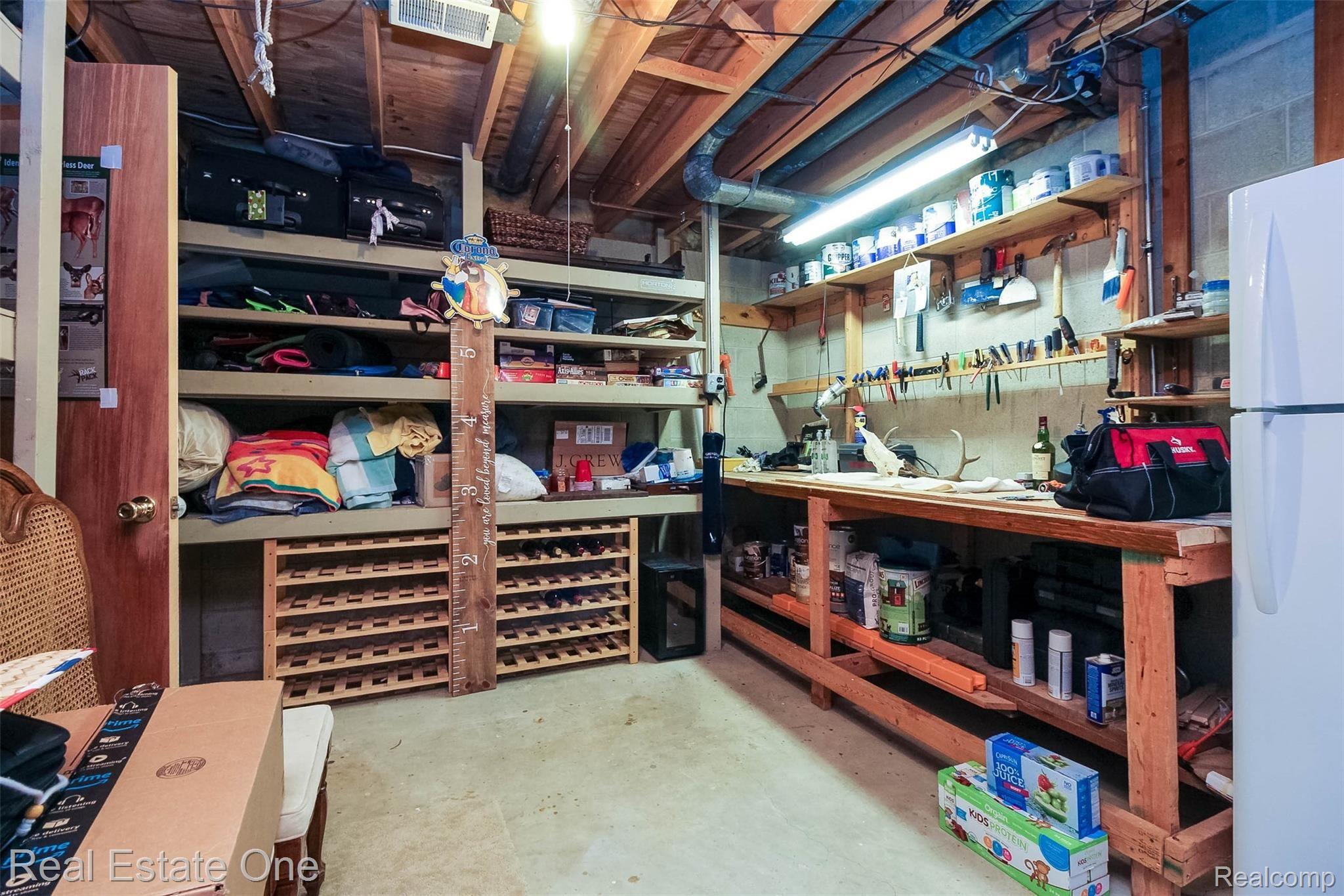 475 Grace Avenue Rochester, MI 48307 - Photo 37 of 58 Large Storage area with built in shelves /work bench - Fridge to stay