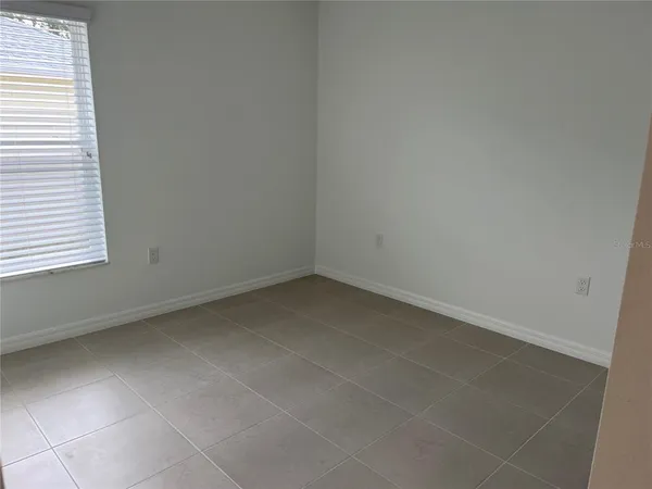 a view of a room that has a window in it