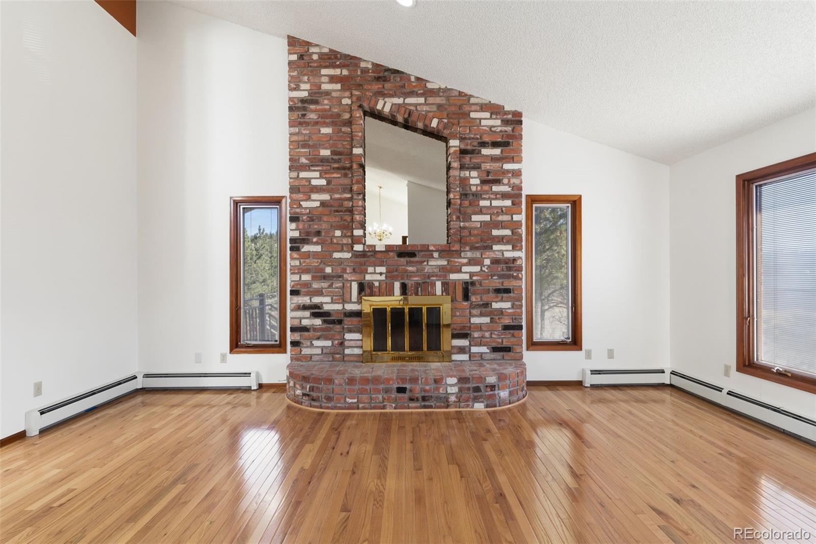 485 West Woodmen Road Colorado Springs, CO 80919 - Photo 12 of 50 wooden floor in an empty room with a window
