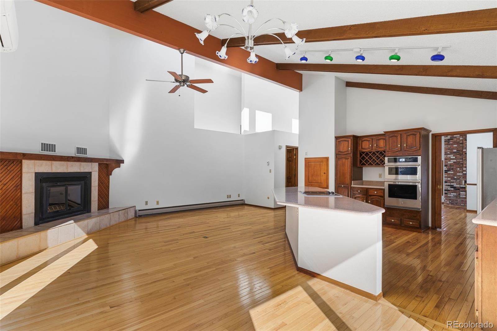 485 West Woodmen Road Colorado Springs, CO 80919 - Photo 15 of 50 a view of a livingroom with furniture and a fireplace