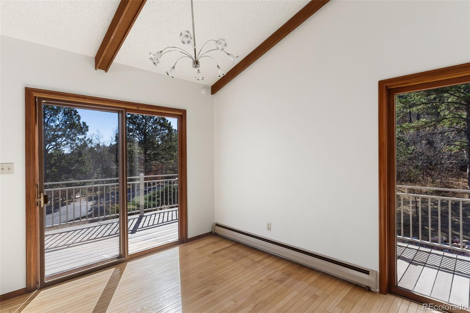 485 West Woodmen Road Colorado Springs, CO 80919 - Photo 24 of 50 a view of a room with wooden floor and windows
