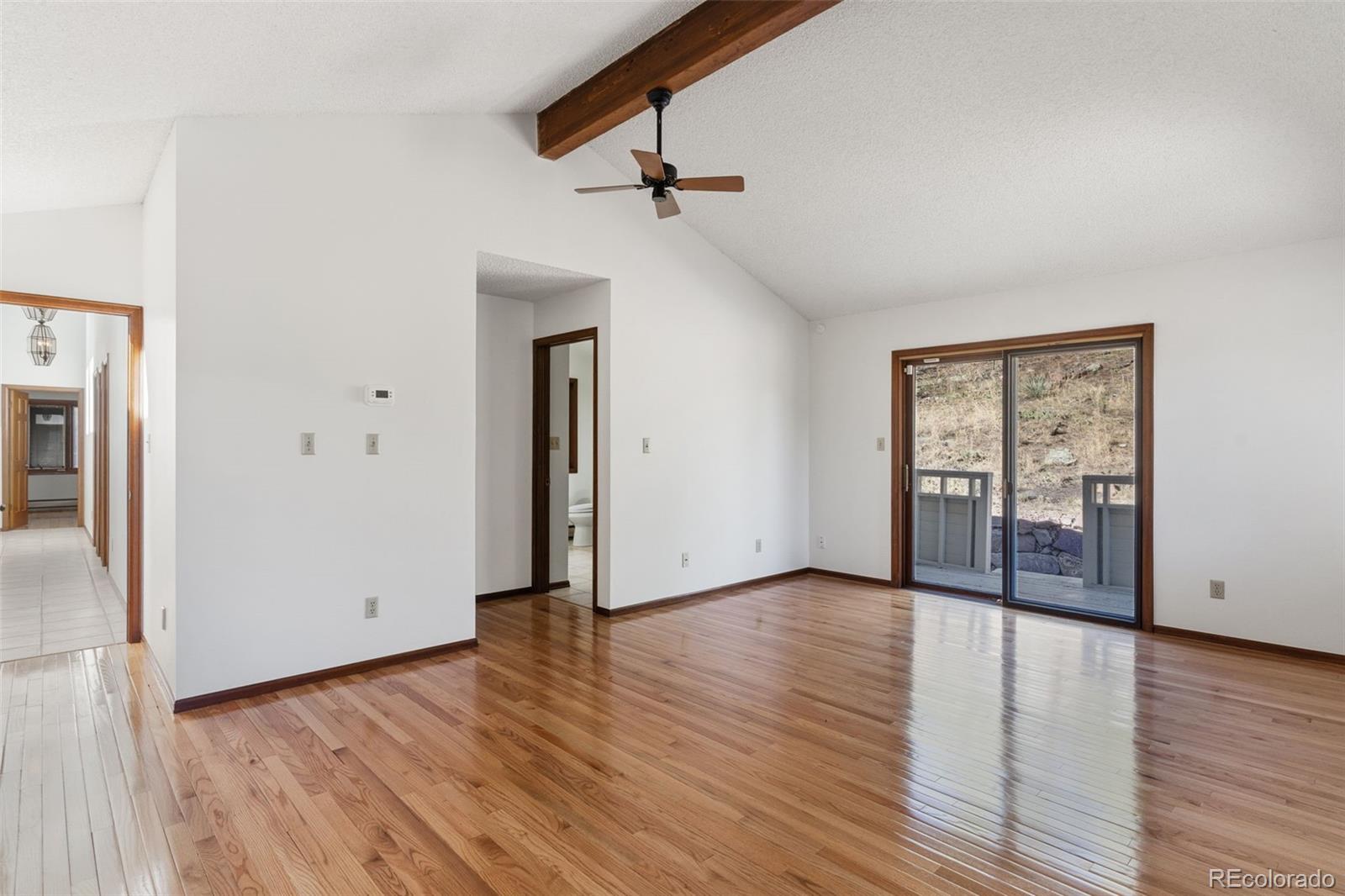 485 West Woodmen Road Colorado Springs, CO 80919 - Photo 26 of 50 wooden floor in an empty room with a window