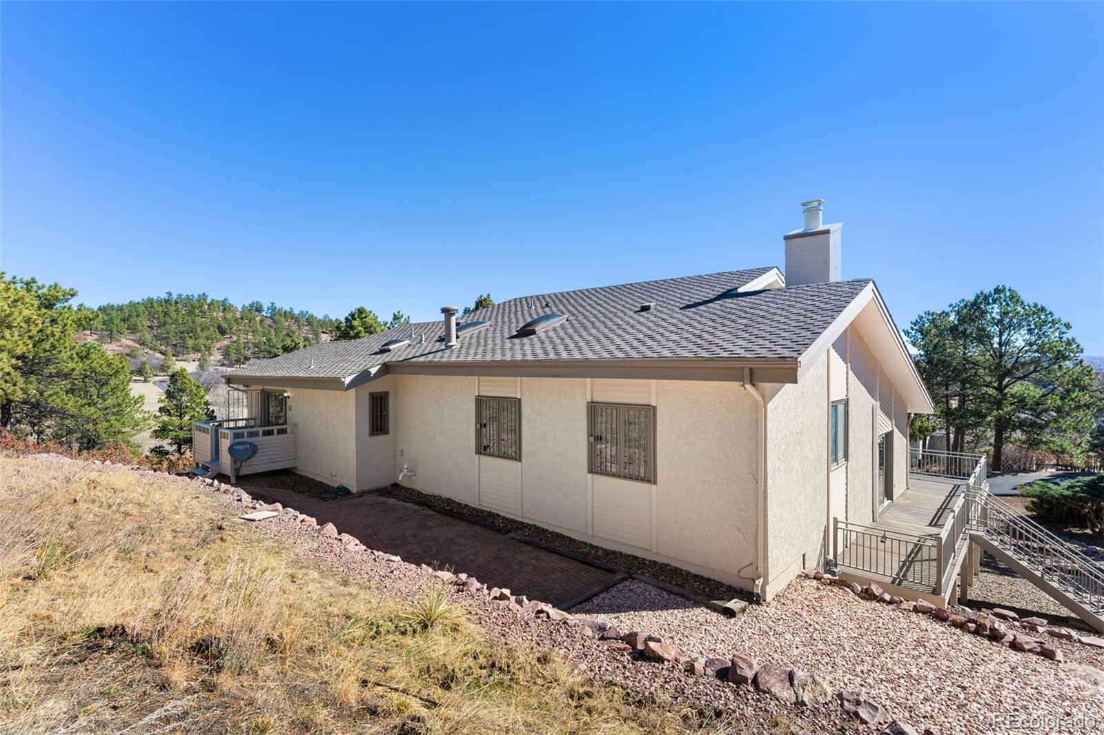 485 West Woodmen Road Colorado Springs, CO 80919 - Photo 48 of 50 a view of a house with a wooden fence
