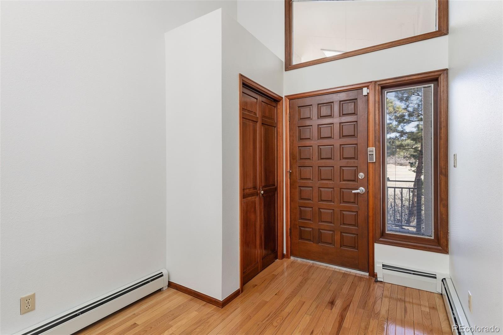 485 West Woodmen Road Colorado Springs, CO 80919 - Photo 9 of 50 wooden floor in an empty room with a window