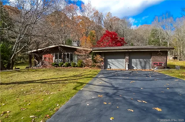 a view of swimming pool with outdoor seating
