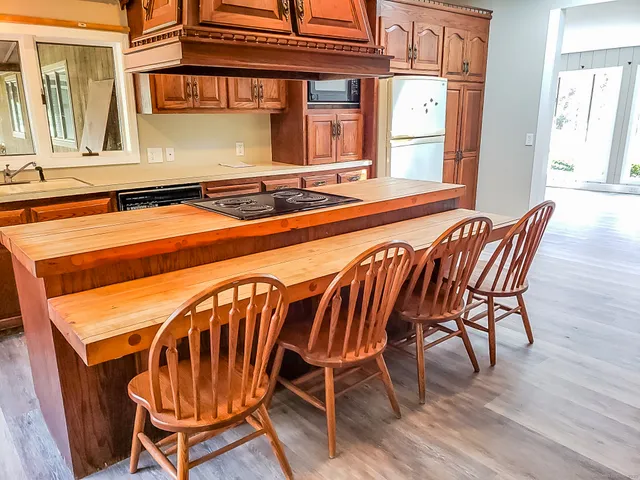 a dining room with furniture and wooden floor