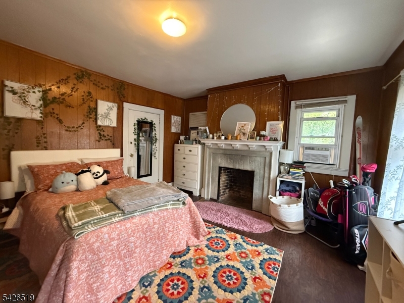 775 Bloomfield Avenue, Unit 2 Montclair, NJ 07042 - Photo 11 of 15 a bedroom with a bed and a fireplace