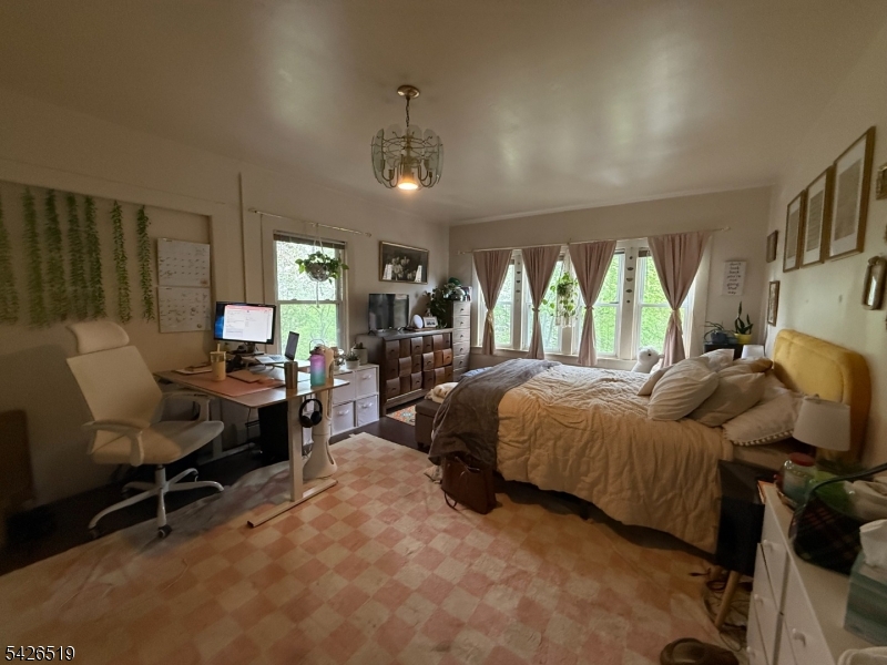 775 Bloomfield Avenue, Unit 2 Montclair, NJ 07042 - Photo 12 of 15 a bed room with a bed and a chair