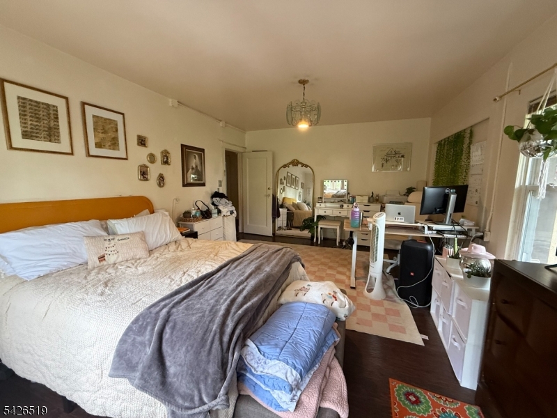 775 Bloomfield Avenue, Unit 2 Montclair, NJ 07042 - Photo 13 of 15 a bed room with a bed and a chair