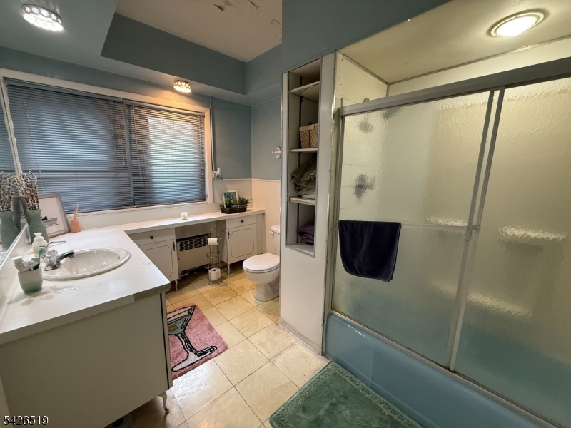 775 Bloomfield Avenue, Unit 2 Montclair, NJ 07042 - Photo 7 of 15 a bathroom with a sink and mirror with bathtub