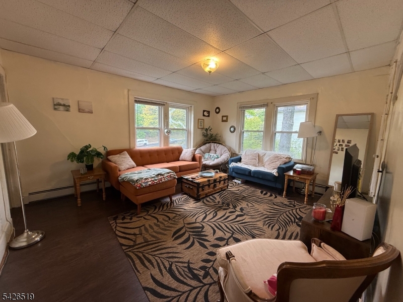 775 Bloomfield Avenue, Unit 2 Montclair, NJ 07042 - Photo 8 of 15 a living room with furniture a window and a fireplace