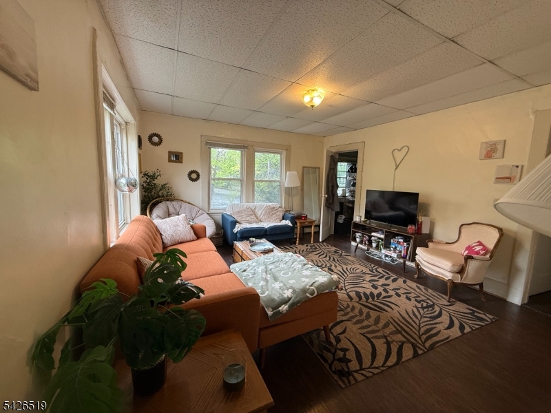775 Bloomfield Avenue, Unit 2 Montclair, NJ 07042 - Photo 9 of 15 a living room with furniture and a flat screen tv