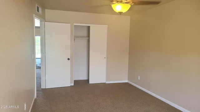a kitchen with a refrigerator and a sink