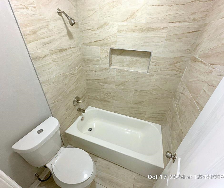 3747 Parakeet Road Memphis, TN 38109 - Photo 5 of 9 Bathroom with tiled shower / bath combo and toilet