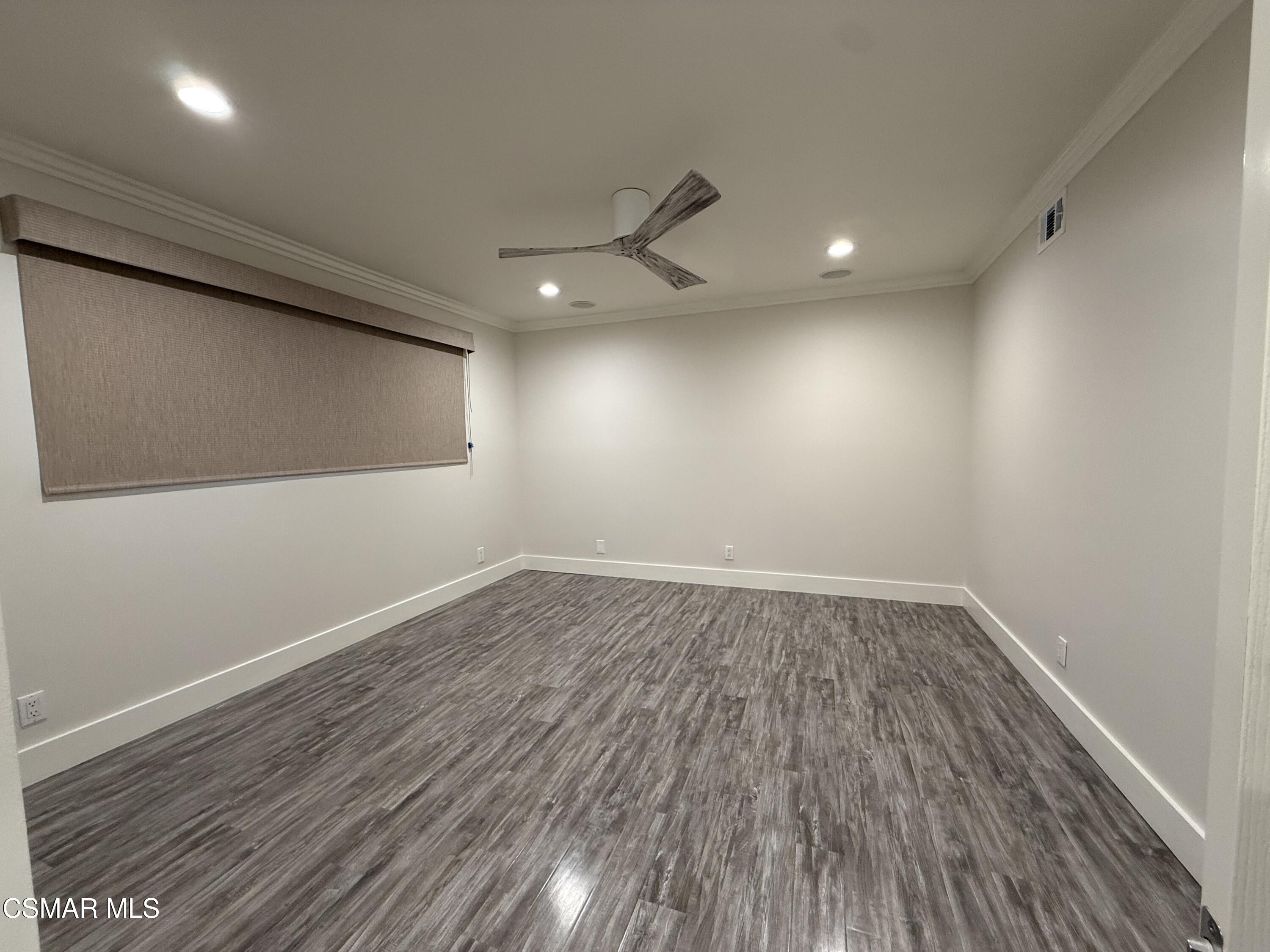 3446 Travis Avenue Simi Valley, CA 93063 - Photo 19 of 36 an empty room with wooden floor and windows