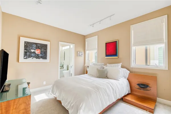 a bedroom with a bed and a couch