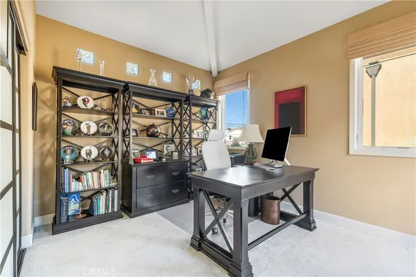 a workspace with furniture and window