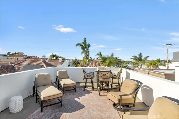 a view of a chairs and table in patio