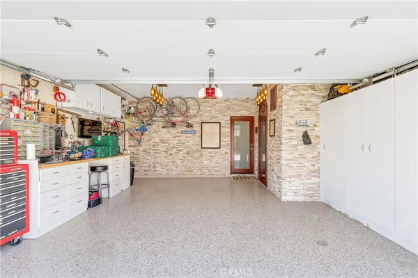 a front view of a house with parking area