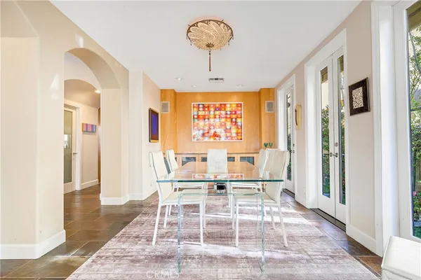 a dining room with furniture and window