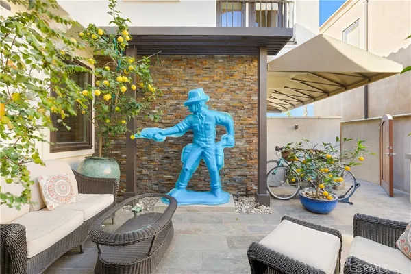 a front view of a house with outdoor seating