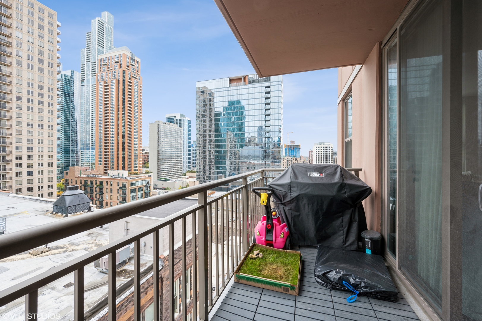1101 South State Street, Unit H1504 Chicago, IL 60605 - Photo 12 of 16 a view of balcony with couch and chairs