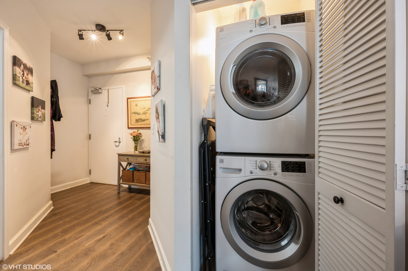 1101 South State Street, Unit H1504 Chicago, IL 60605 - Photo 10 of 16 a view of a hallway with washer and dryer