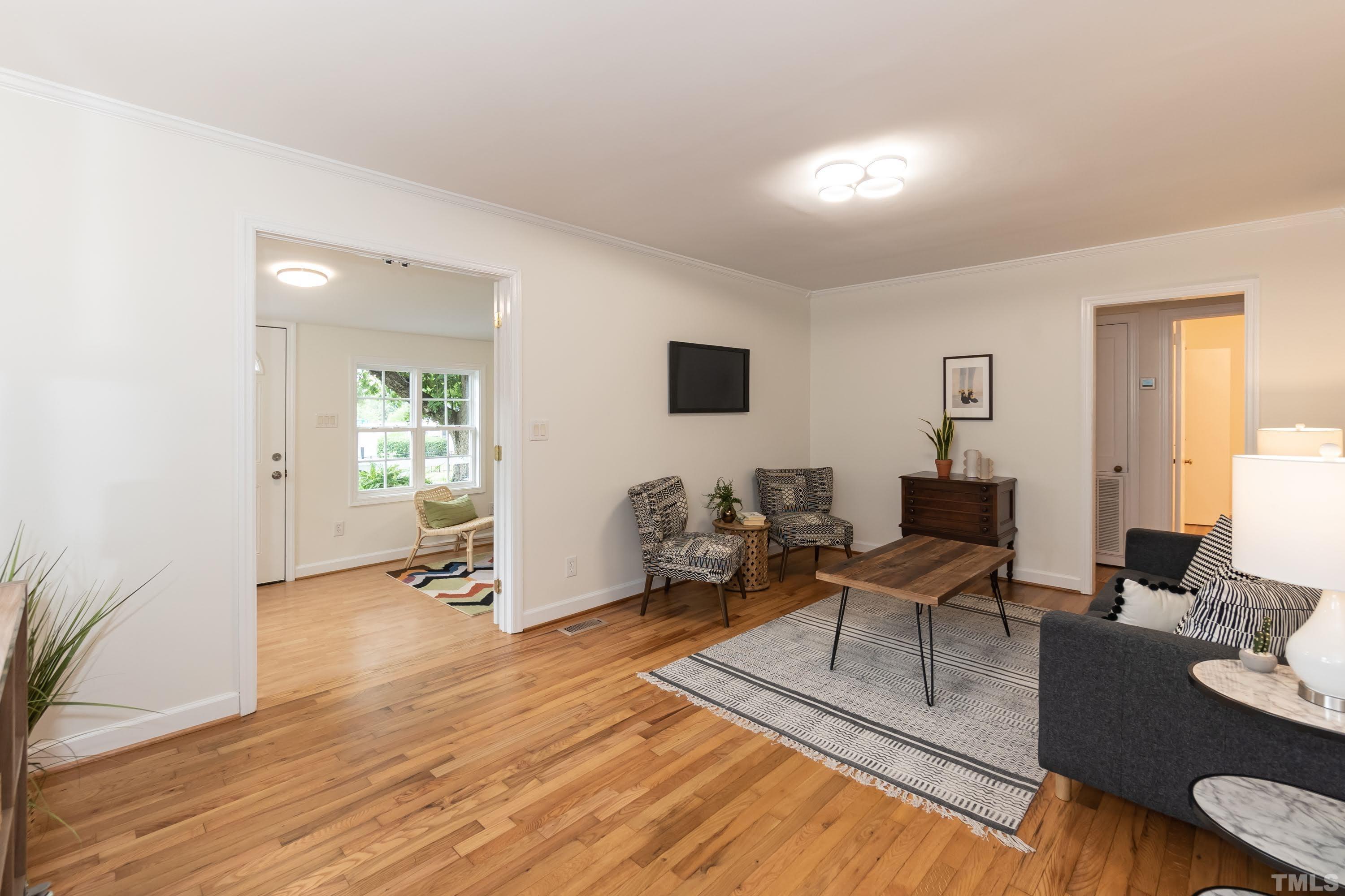 1720 Bennett Street Raleigh, NC 27604 - Photo 11 of 46 a living room with furniture and a wooden floor