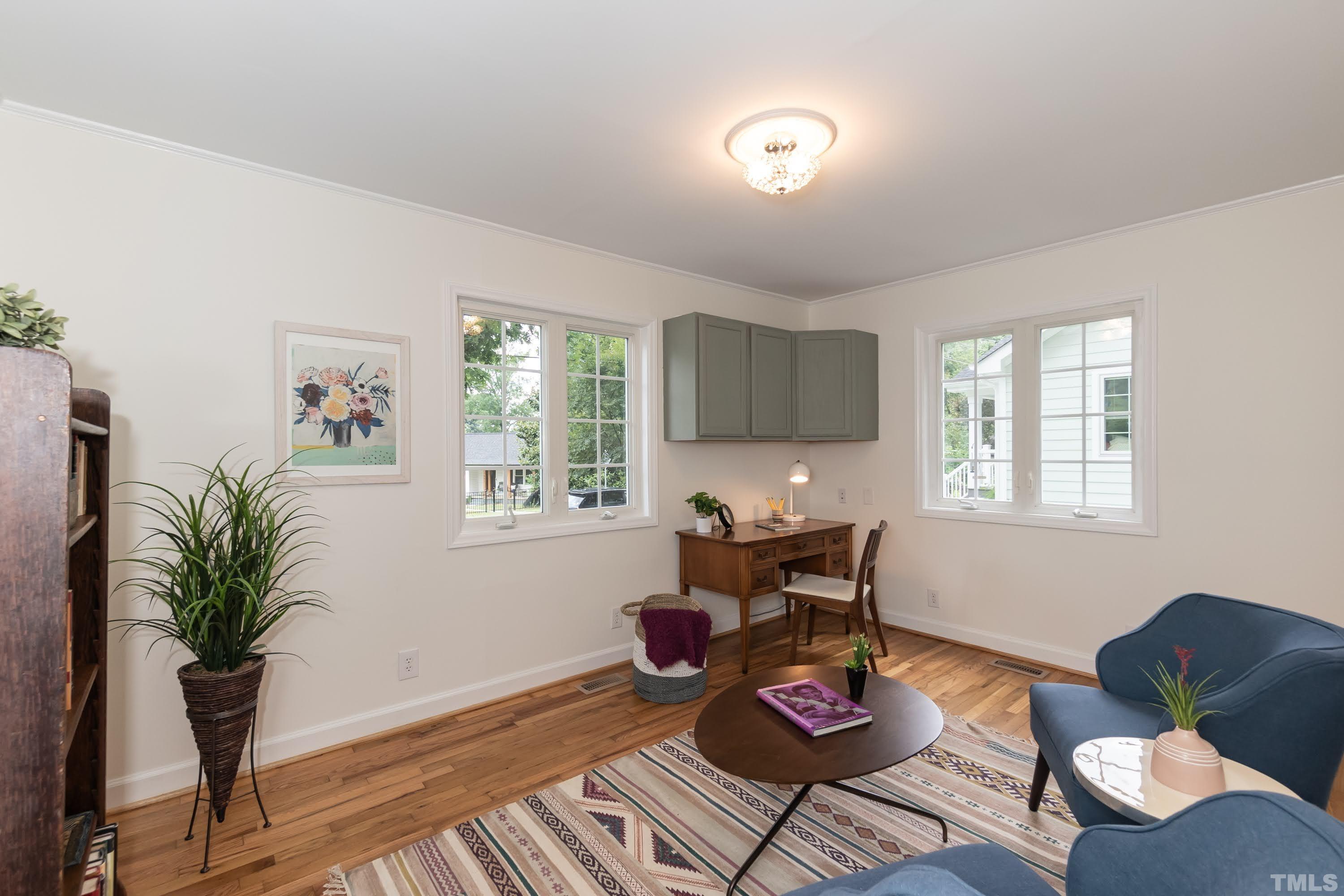 1720 Bennett Street Raleigh, NC 27604 - Photo 13 of 46 a living room with furniture and a potted plant