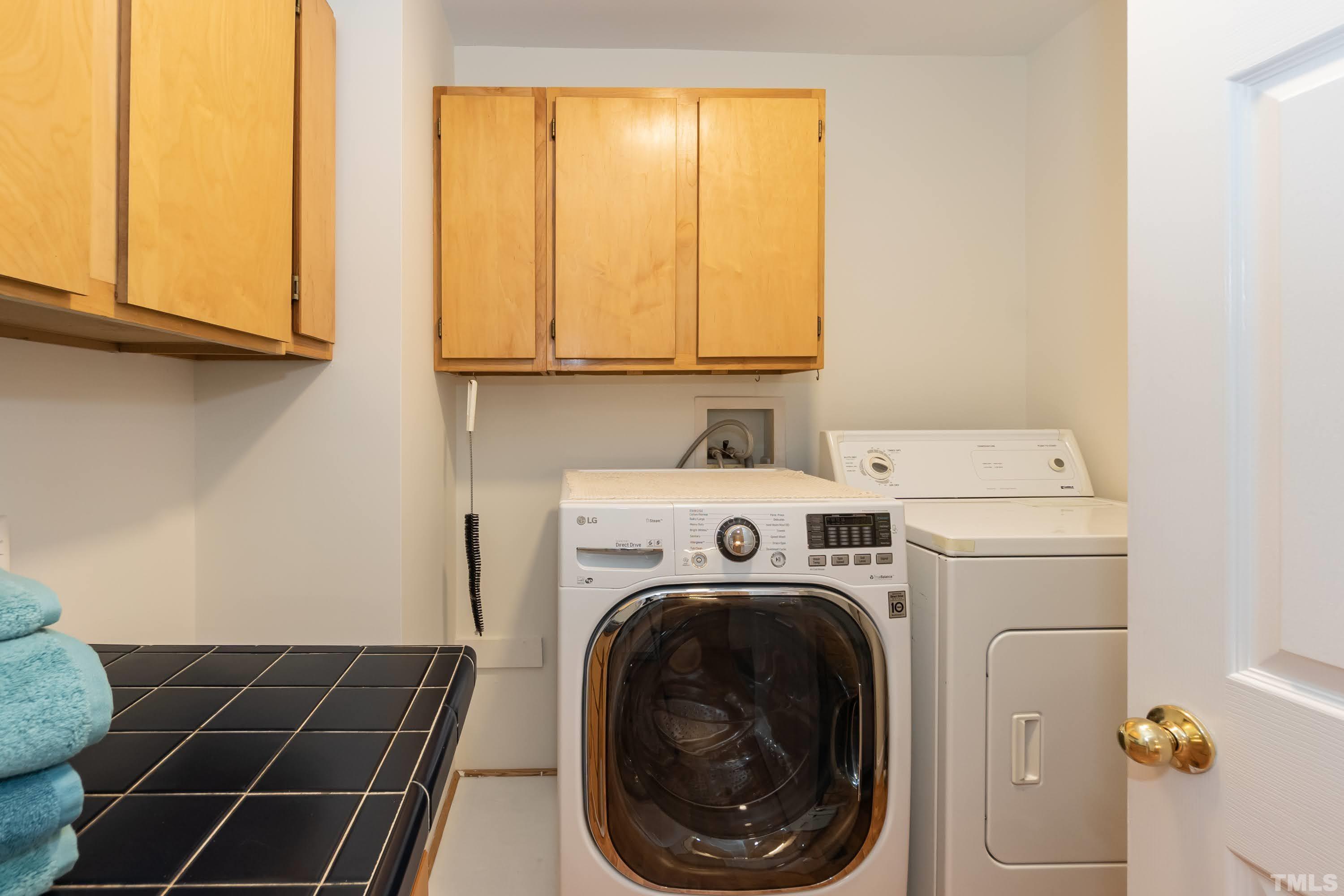 1720 Bennett Street Raleigh, NC 27604 - Photo 18 of 46 a utility room with dryer and washer