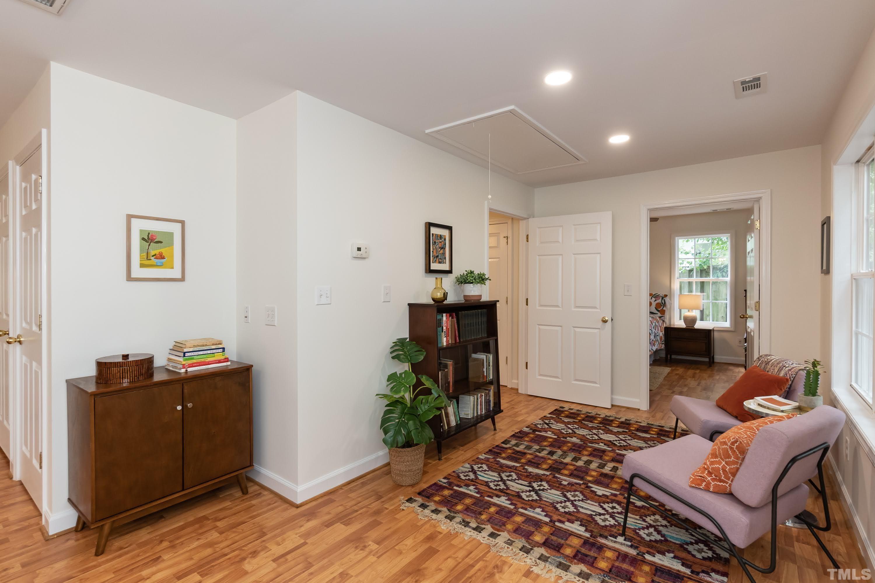 1720 Bennett Street Raleigh, NC 27604 - Photo 20 of 46 a bedroom with furniture and a wooden floor