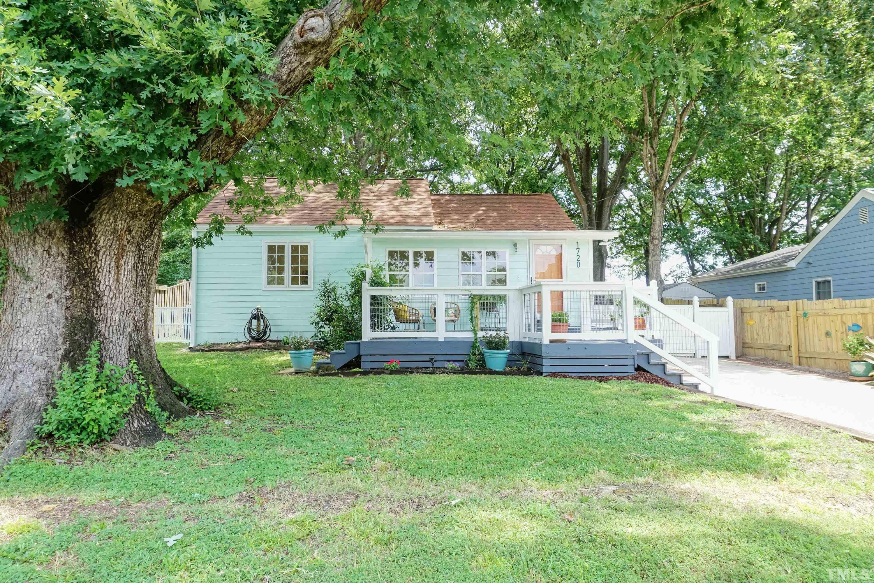 1720 Bennett Street Raleigh, NC 27604 - Photo 2 of 46 a view of a house with a yard and sitting area