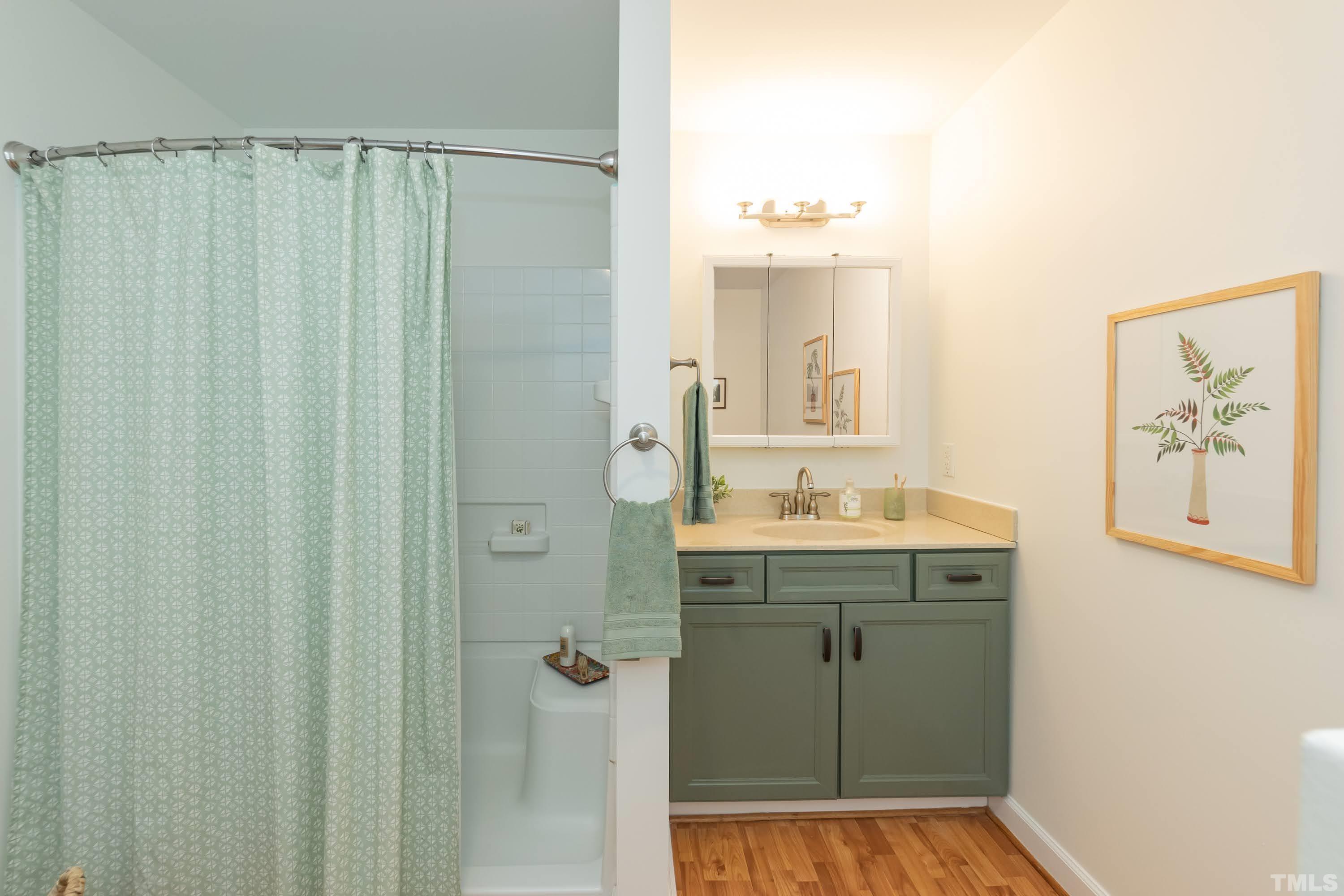 1720 Bennett Street Raleigh, NC 27604 - Photo 22 of 46 a bathroom with a shower and a sink