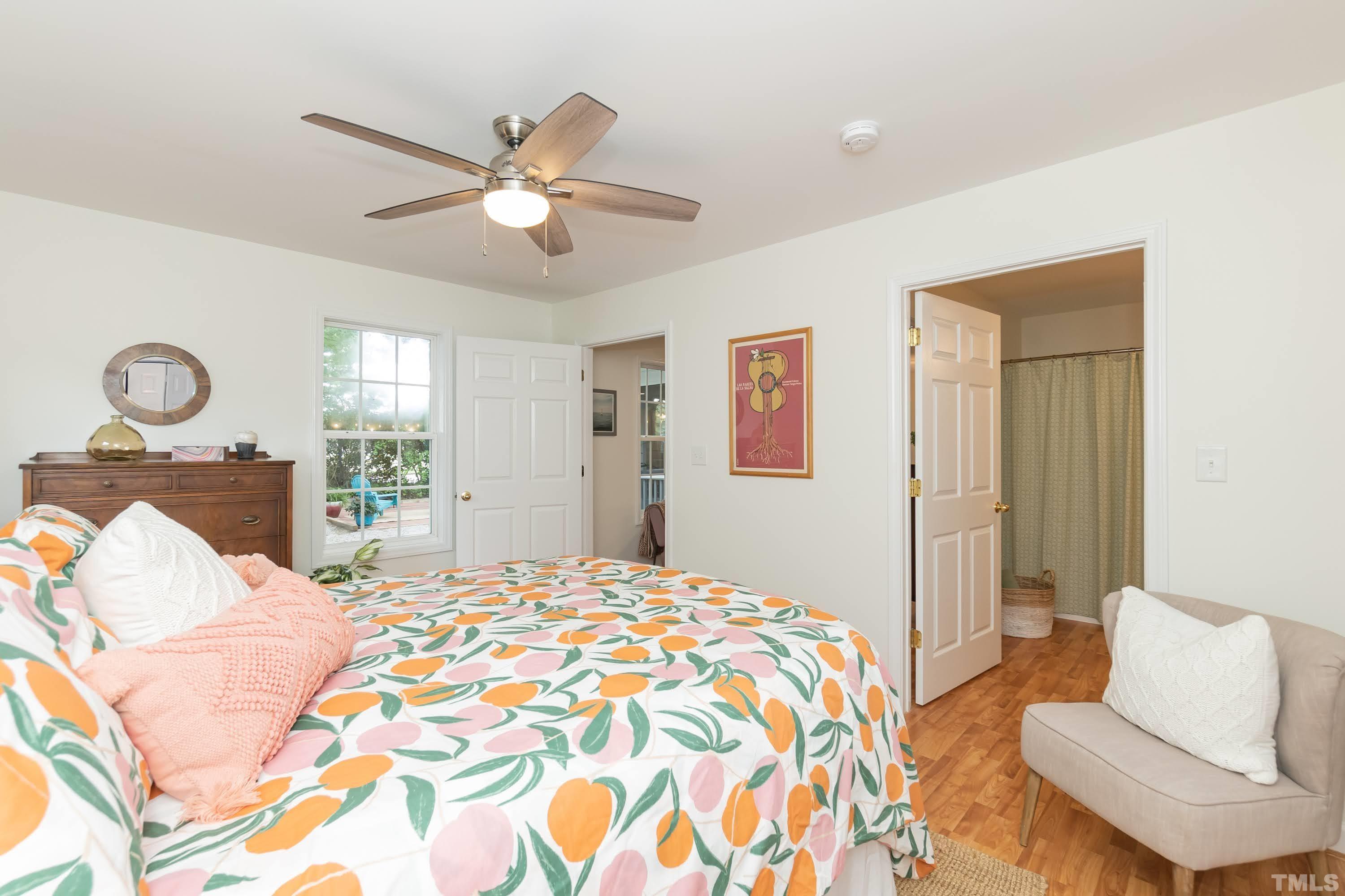 1720 Bennett Street Raleigh, NC 27604 - Photo 23 of 46 a bedroom with a bed and wooden floor