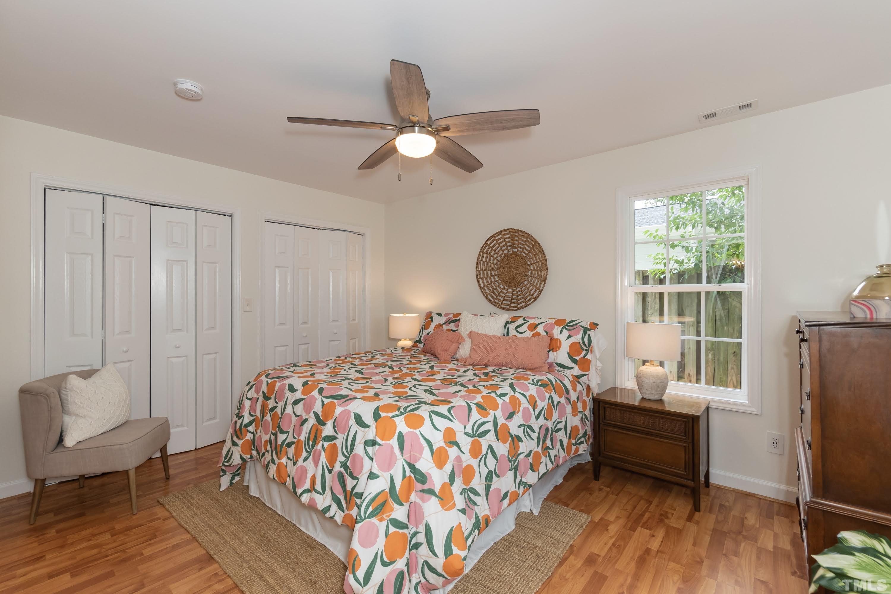 1720 Bennett Street Raleigh, NC 27604 - Photo 24 of 46 a bedroom with a bed and wooden floor