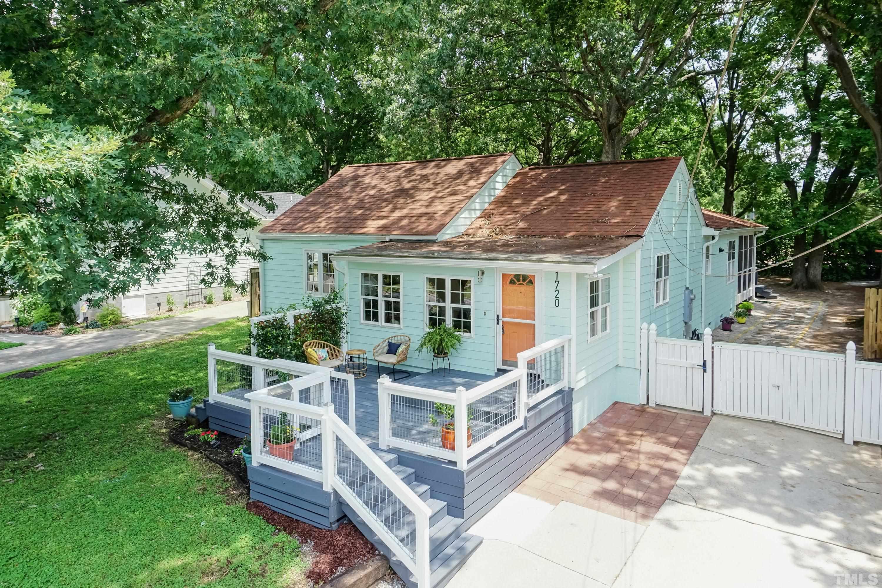 1720 Bennett Street Raleigh, NC 27604 - Photo 43 of 46 a view of a house with backyard porch and sitting area