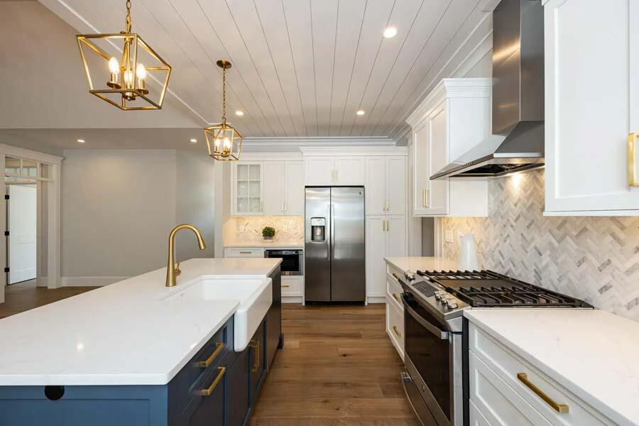 55 Palmer Road Mashpee, MA 02649 - Photo 11 of 42 a kitchen with refrigerator a stove and a chandelier