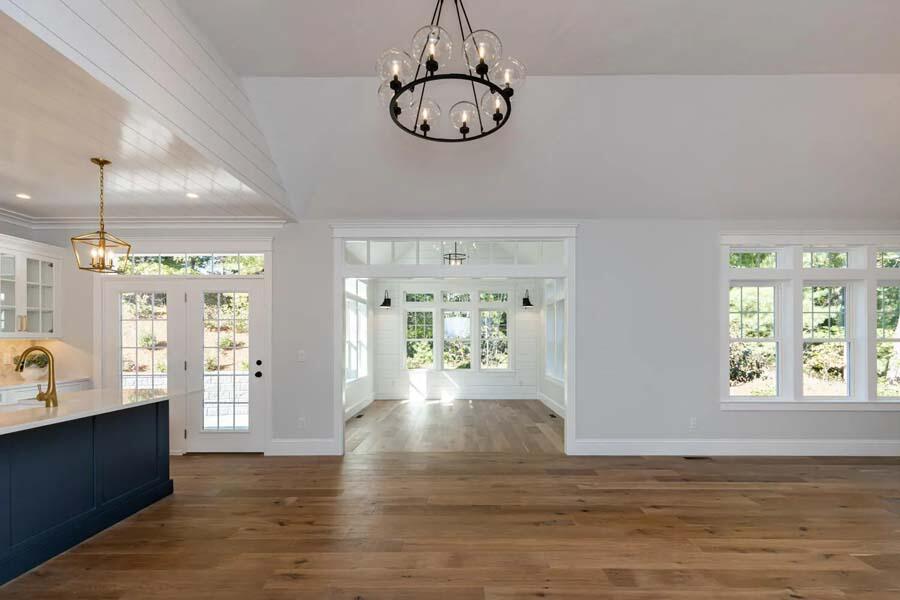 55 Palmer Road Mashpee, MA 02649 - Photo 13 of 42 a view of a hallway with wooden floor and a dining room