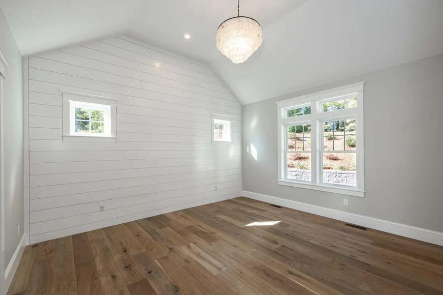 55 Palmer Road Mashpee, MA 02649 - Photo 20 of 42 an empty room with wooden floor and windows